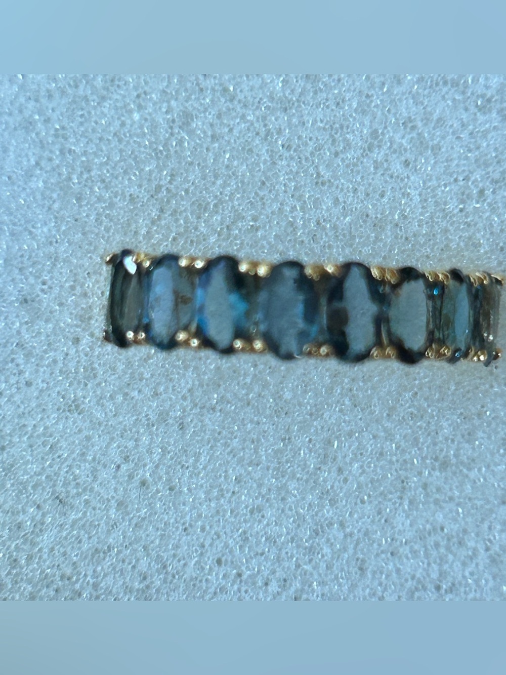 Genuine London Blue Topaz half eternity band 14 kit gold over sterling silver.